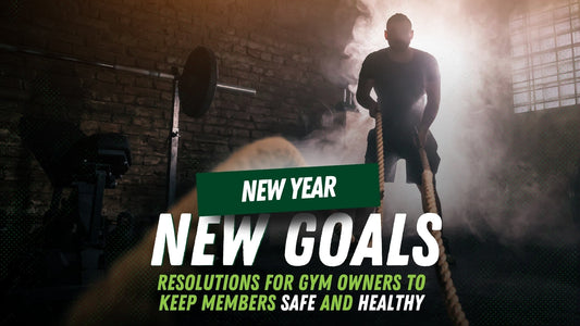 Man using cardio ropes in a workout with smoke behind him at the gym. Text in front reads "New year, new goals: resolutions for gym owners to keep members safe and healthy"